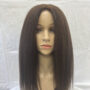 Mannequin head with long, straight black hair against a plain background.